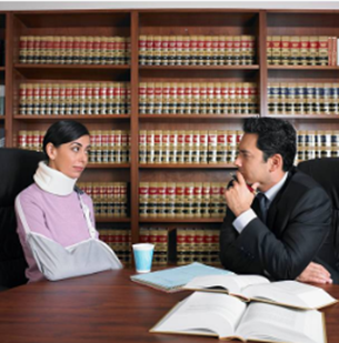 A personal injury lawyer advises a woman in a courtroom, highlighting their legal situation.